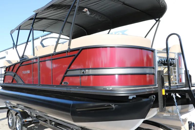 Slide: The Image of 2024 Sylvan L3 RLZ pontoon boat with red exterior and black canopy. - 12