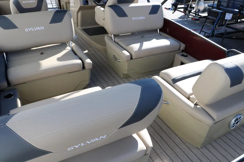 Slide: The Image of 2024 Sylvan L3 RLZ boat interior with beige and gray seating. - 19