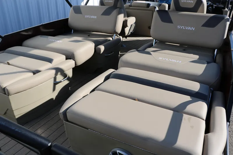 Slide: The Image of 2024 Sylvan L3 RLZ boat interior with luxurious beige seating. - 23