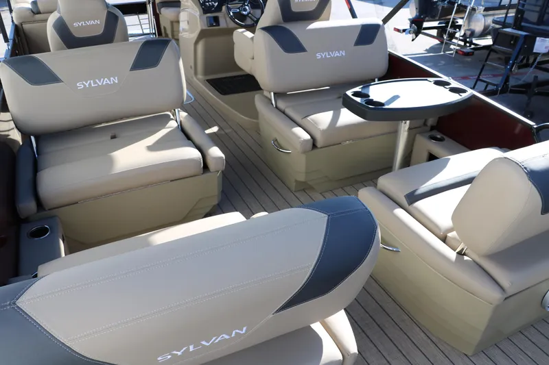 Slide: The Image of 2024 Sylvan L3 RLZ boat interior with beige seating and table. - 27