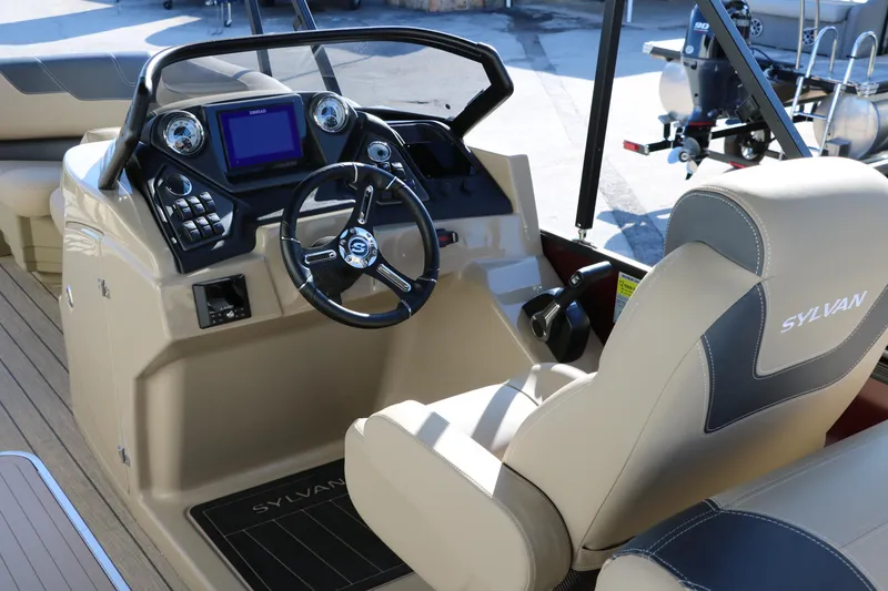 Slide: The Image of 2024 Sylvan L3 RLZ boat cockpit with steering wheel and control panel. - 29