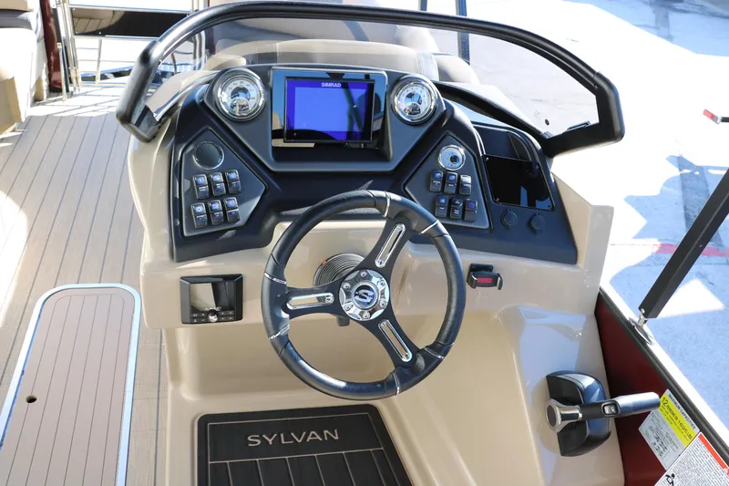 Slide: The Image of 2024 Sylvan L3 RLZ boat dashboard with steering wheel and control panel. - 30
