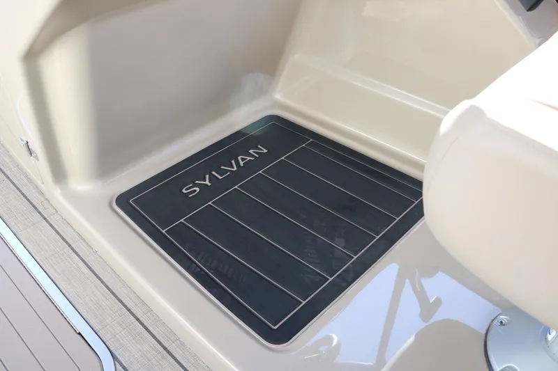 Slide: The Image of 2024 Sylvan L3 RLZ boat interior with branded floor mat. - 36