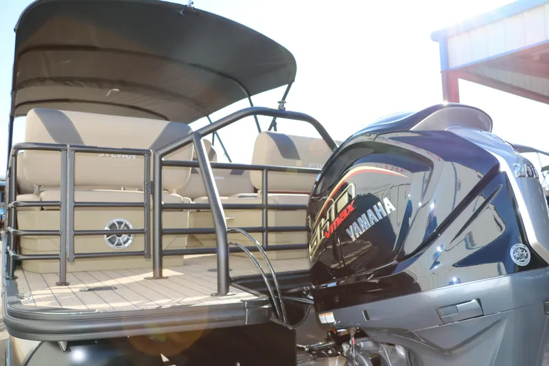 Slide: The Image of 2024 Sylvan L3 RLZ pontoon boat with Yamaha outboard motor. - 4
