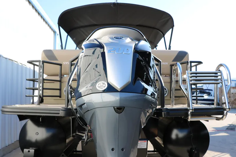Slide: The Image of 2024 Sylvan L3 RLZ pontoon boat with powerful outboard motor. - 5