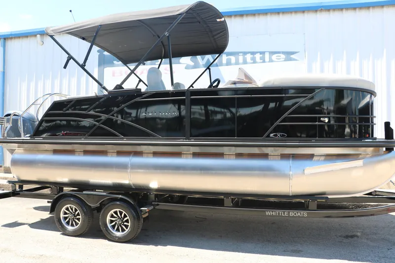 The Image of 2025 Sylvan X1 CLZ DH Tri-Toon boat on trailer with canopy. - 0
