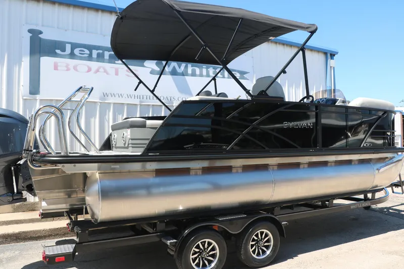 Slide: The Image of 2025 Sylvan X1 CLZ DH Tri-Toon boat on trailer with canopy. - 15