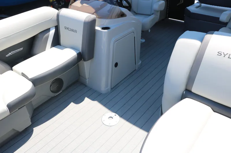 Slide: The Image of 2025 Sylvan X1 CLZ DH Tri-Toon boat interior with comfortable seating and modern design. - 18