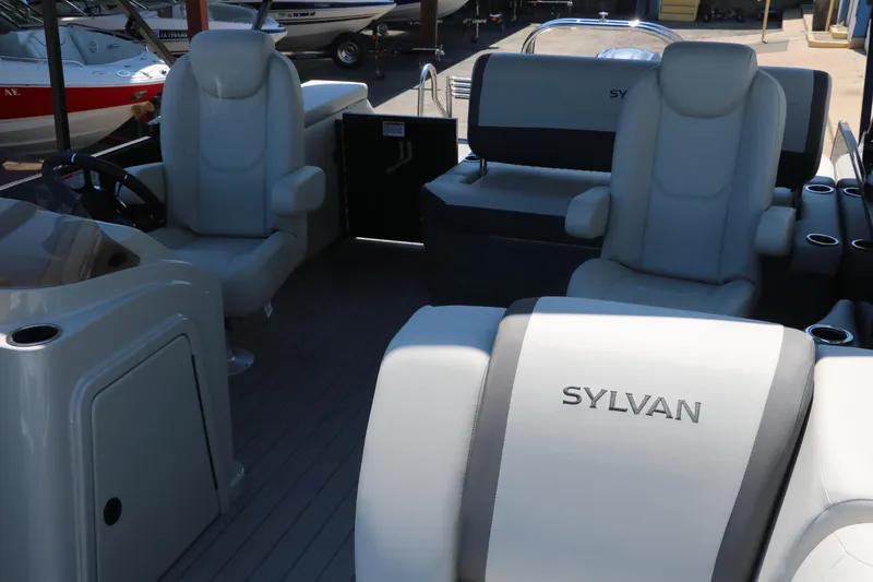Slide: The Image of 2025 Sylvan X1 CLZ DH Tri-Toon boat interior with luxurious seating. - 20