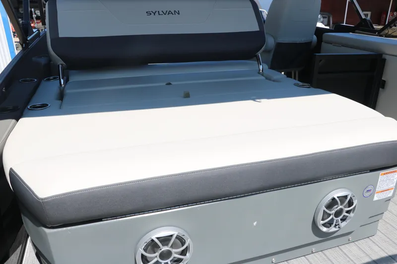 Slide: The Image of 2025 Sylvan X1 CLZ DH Tri-Toon boat interior with cushioned seating and built-in speakers. - 22