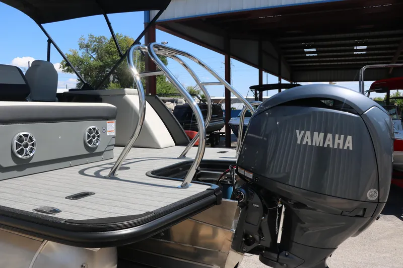 Slide: The Image of 2025 Sylvan X1 CLZ DH Tri-Toon with Yamaha outboard motor. - 5