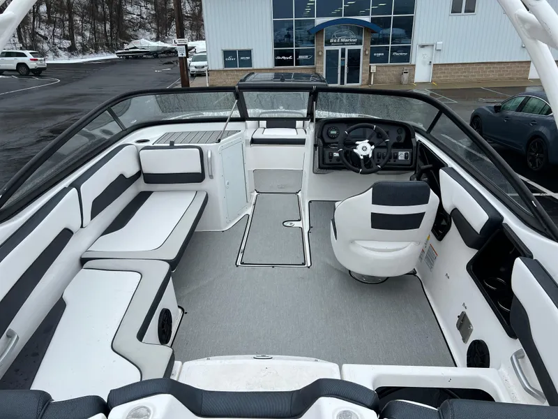Slide: The Image of 2021 Yamaha Boats AR 195 interior, spacious seating, modern dashboard, and sleek design. - 10