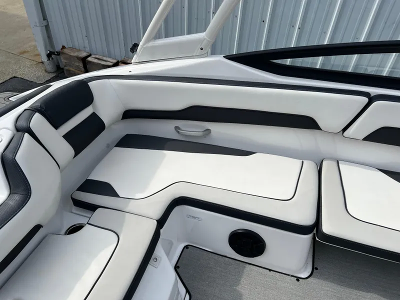 Slide: The Image of 2021 Yamaha Boats AR 195 interior seating with black and white upholstery. - 7