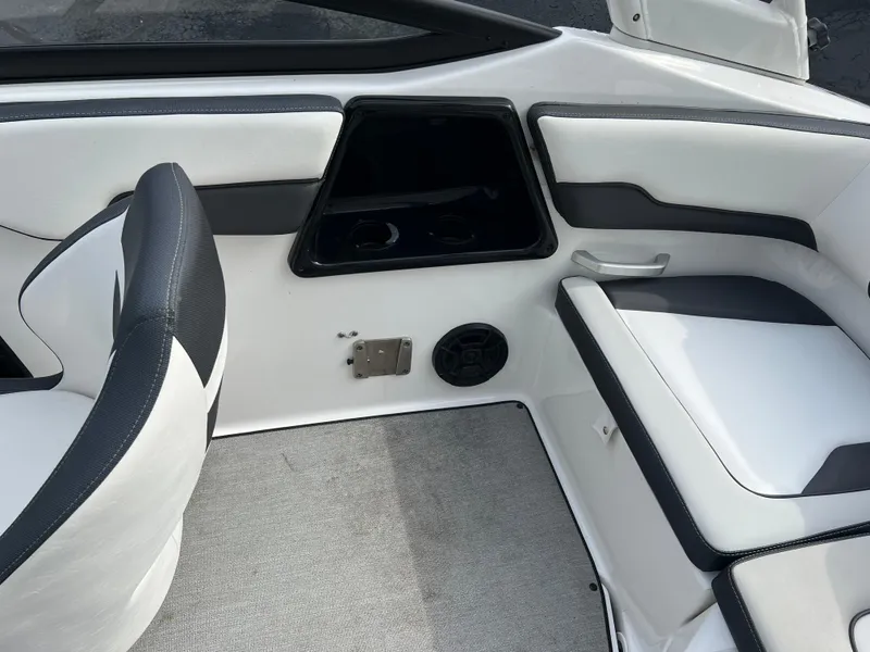 Slide: The Image of 2021 Yamaha Boats AR 195 interior seating and dashboard. - 9