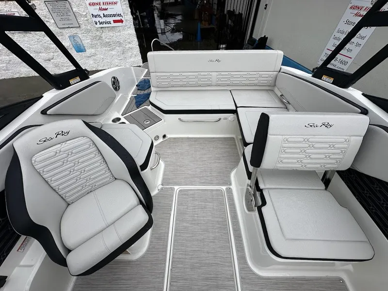 Slide: The Image of 2024 Sea Ray SPX 210 boat interior with white and black seating. - 13