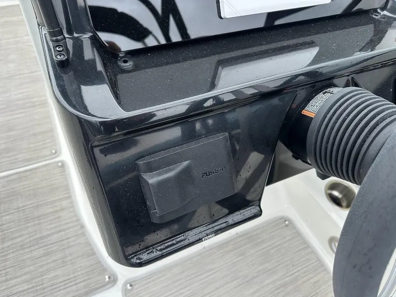 Slide: The Image of Close-up of the 2024 Sea Ray SPX 210 dashboard and control panel. - 16