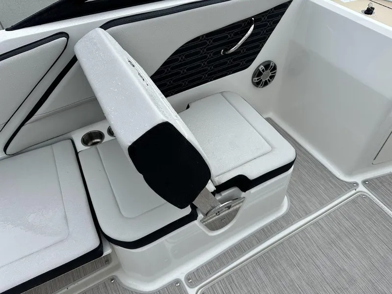 Slide: The Image of 2024 Sea Ray SPX 210 boat interior seating with black and white upholstery. - 23