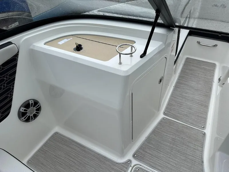 Slide: The Image of 2024 Sea Ray SPX 210 boat interior with storage compartment and speaker. - 24