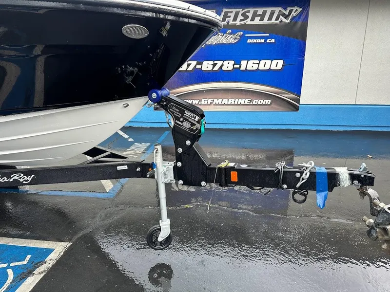 Slide: The Image of 2024 Sea Ray SPX 210 boat on trailer at dealership. - 26