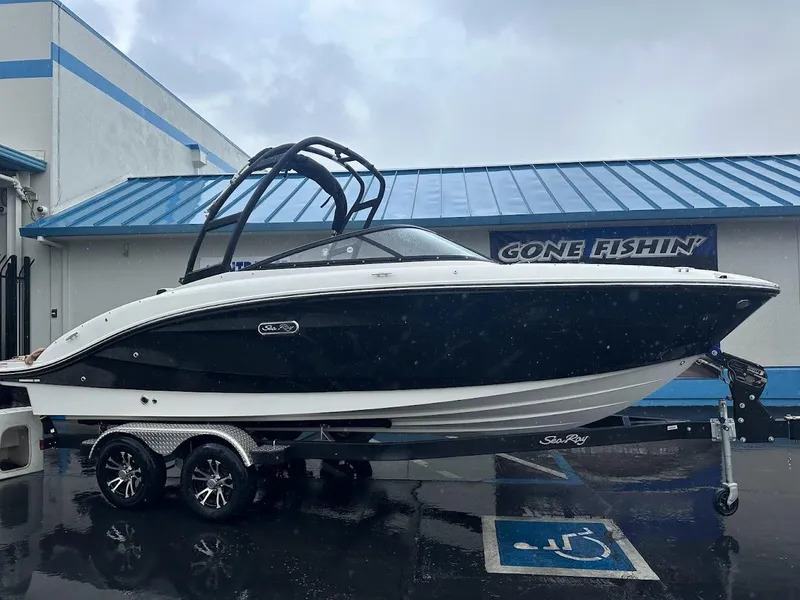 Slide: The Image of 2024 Sea Ray SPX 210 boat on trailer outside dealership. - 3