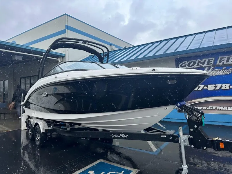 Slide: The Image of 2024 Sea Ray SPX 210 boat on trailer in front of dealership. - 4