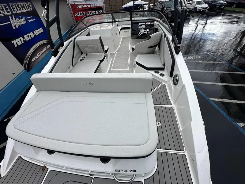 Slide: The Image of 2024 Sea Ray SPX 210 boat interior with seating and deck view. - 8
