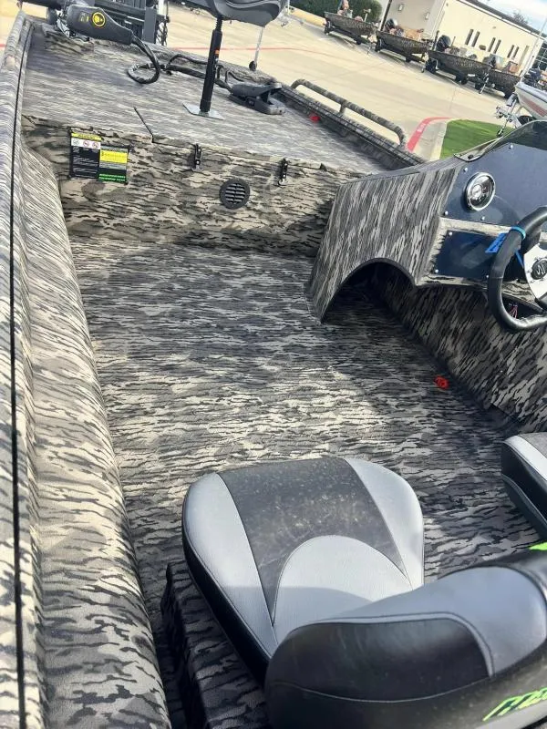 Slide: The Image of 2024 Havoc Boats 1756 FRRSCST interior with camo pattern and seating. - 11