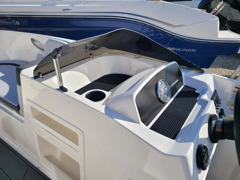 Slide: The Image of 2024 Bayliner M17 boat dashboard and controls. - 11