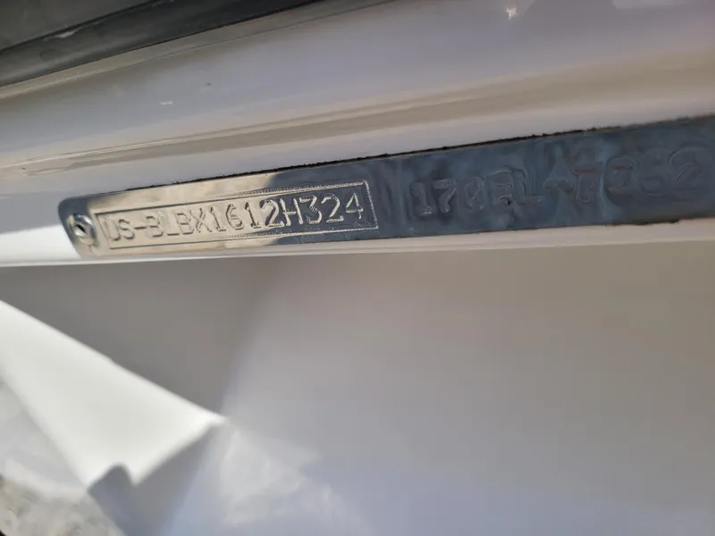 Slide: The Image of 2024 Bayliner M17 hull identification number (HIN) plate close-up. - 13