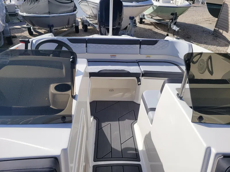 Slide: The Image of 2024 Bayliner M17 boat interior with seating and steering console. - 3