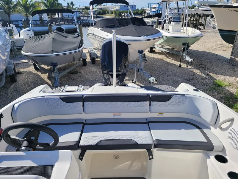 Slide: The Image of 2024 Bayliner M17 boat interior at a marina. - 7