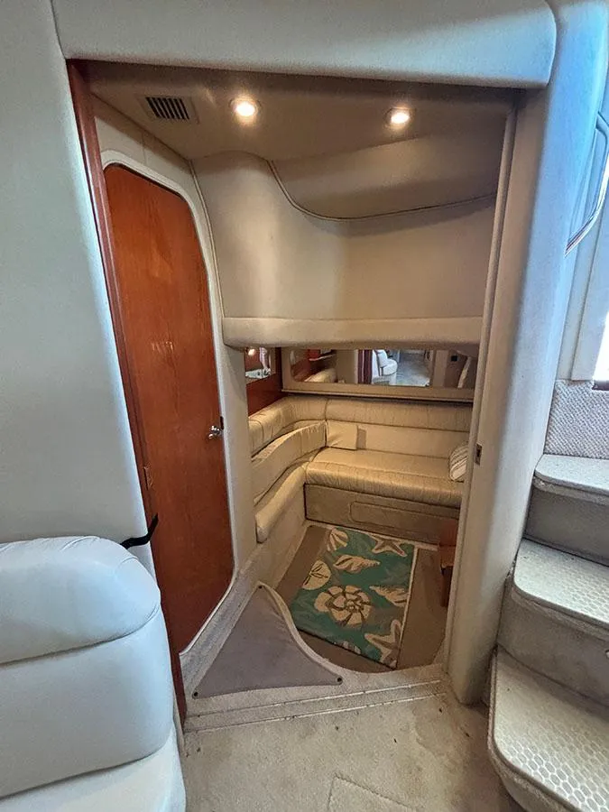 Slide: The Image of Interior cabin of a 2001 Sea Ray 410 Sundancer yacht with seating area. - 14
