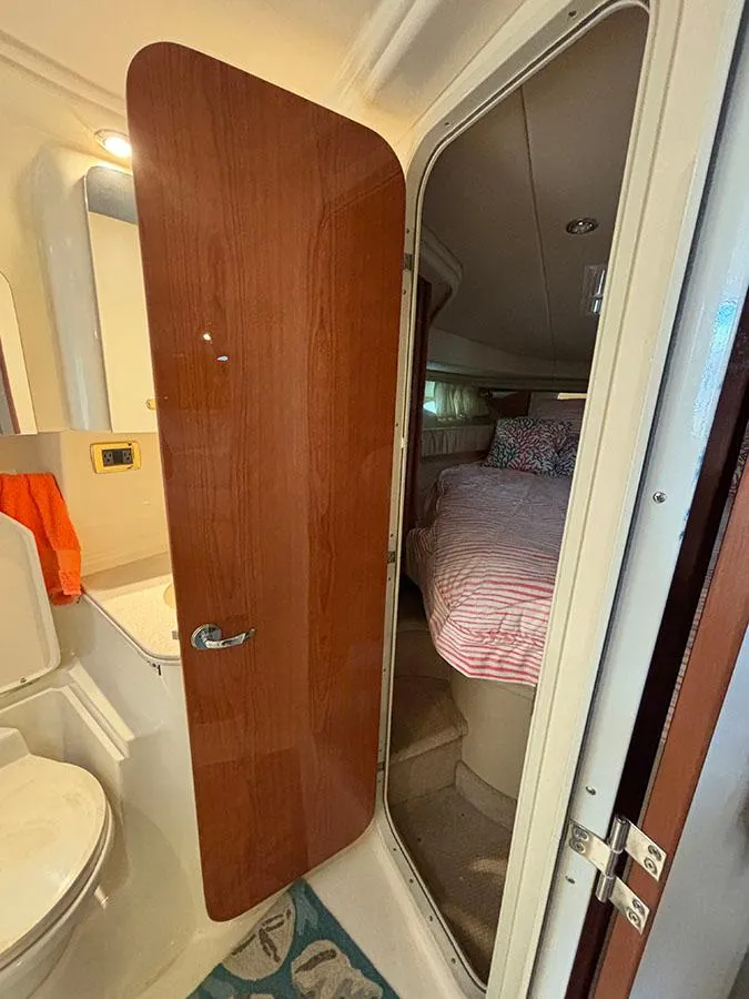 Slide: The Image of 2001 Sea Ray 410 Sundancer interior cabin with bathroom and bedroom view. - 18