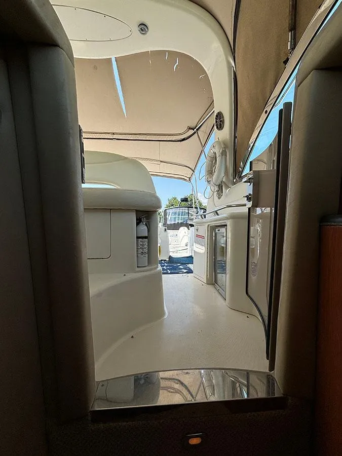 Slide: The Image of Interior view of 2001 Sea Ray 410 Sundancer yacht with beige upholstery. - 25