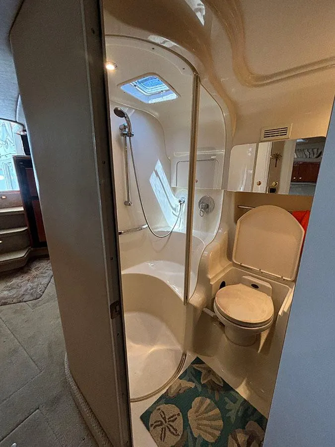 Slide: The Image of 2001 Sea Ray 410 Sundancer bathroom with shower and toilet. - 27