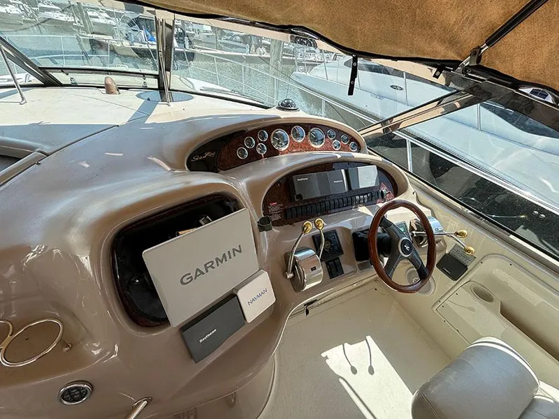 Slide: The Image of 2001 Sea Ray 410 Sundancer helm with Garmin navigation system. - 29