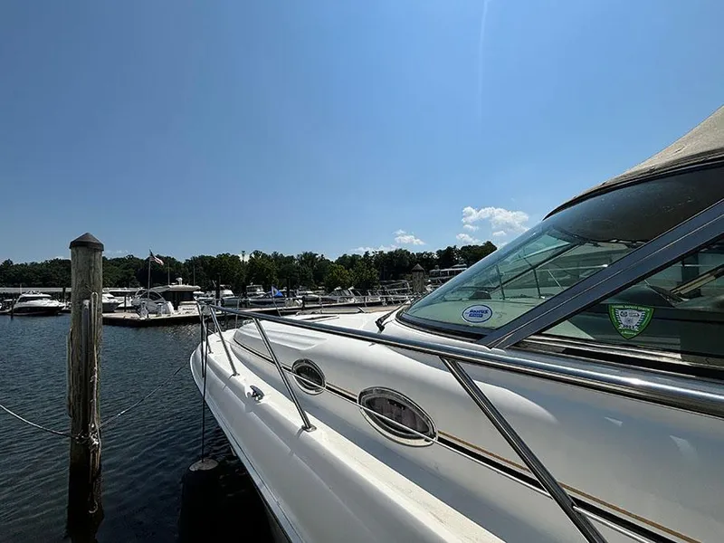 Slide: The Image of 2001 Sea Ray 410 Sundancer docked at a marina on a sunny day. - 3