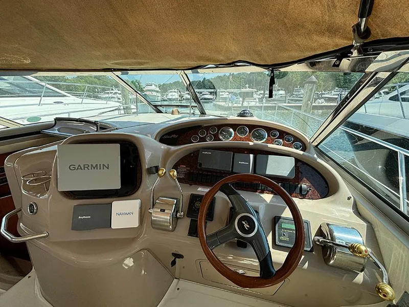 Slide: The Image of 2001 Sea Ray 410 Sundancer helm with Garmin navigation system. - 30