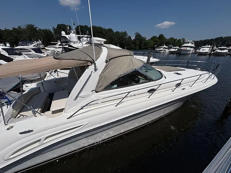 Slide: The Image of 2001 Sea Ray 410 Sundancer yacht docked at a marina on a sunny day. - 4