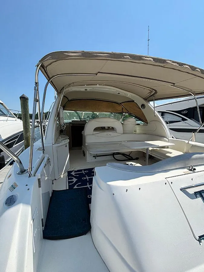 Slide: The Image of 2001 Sea Ray 410 Sundancer yacht with covered seating area. - 5