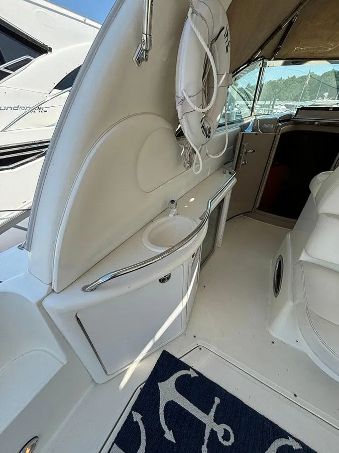 Slide: The Image of 2001 Sea Ray 410 Sundancer interior with sink and life preserver. - 6