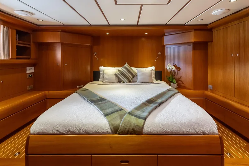 Slide: The Image of Luxurious master cabin of 2005 Jongert 2900M yacht with wooden interiors and cozy bedding. - 13