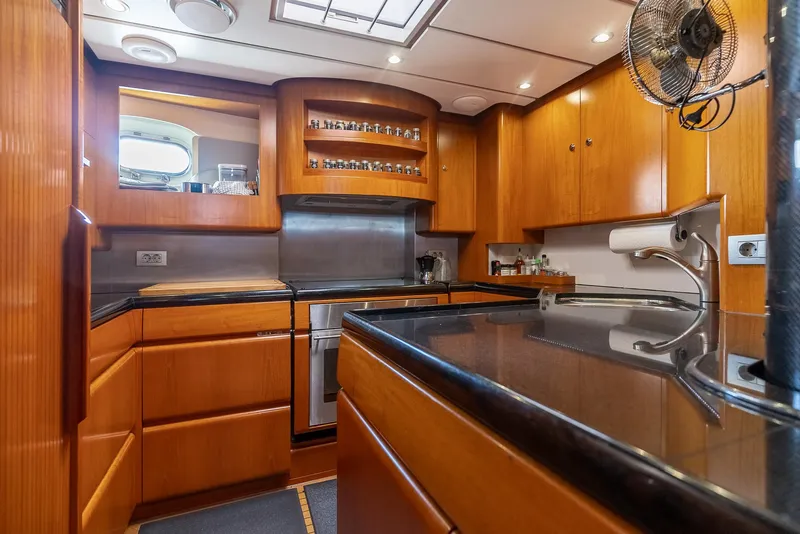 Slide: The Image of Luxurious kitchen interior of a 2005 Jongert 2900M yacht with wooden cabinetry. - 16