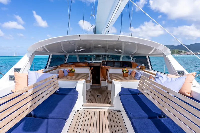 Slide: The Image of Luxurious 2005 Jongert 2900M yacht with spacious outdoor seating and scenic ocean view. - 4