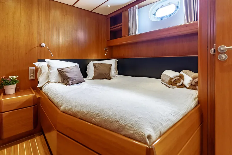 Slide: The Image of Luxurious cabin interior of 2005 Jongert 2900M yacht with cozy bed and wooden finish. - 9