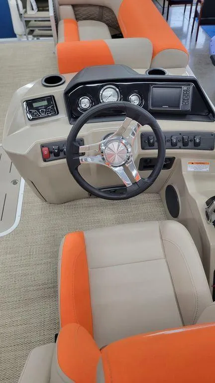 Slide: The Image of 2024 Bennington 20 SL boat interior with steering wheel and dashboard. - 15