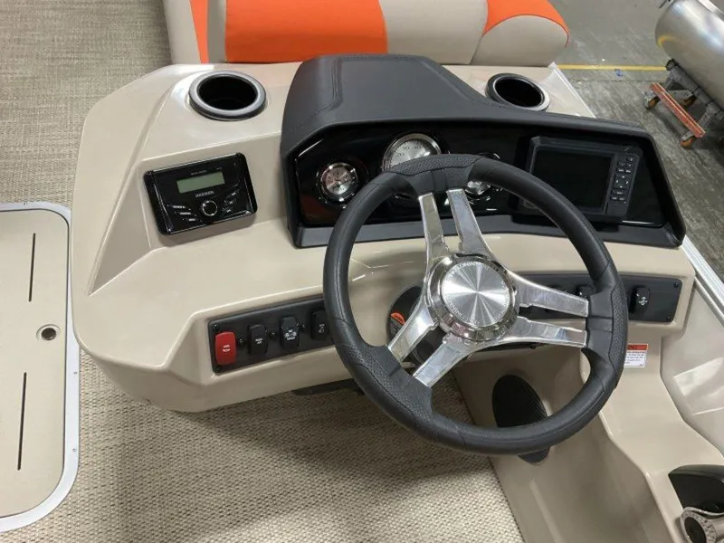 Slide: The Image of 2024 Bennington 20 SL boat dashboard with steering wheel and control panel. - 3