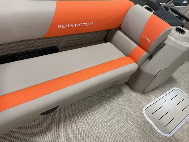 Slide: The Image of 2024 Bennington 20 SL boat interior with orange and beige seating. - 6