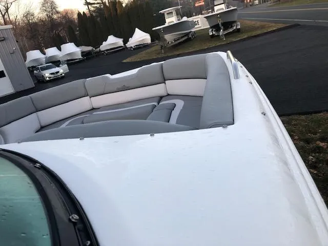 Slide: The Image of 2023 NauticStar 243DC Sport Deck boat with spacious seating area. - 5