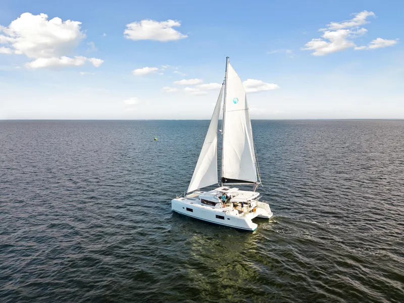Slide: The Image of Lagoon 42 catamaran sailing on open water, 2018 model. - 10